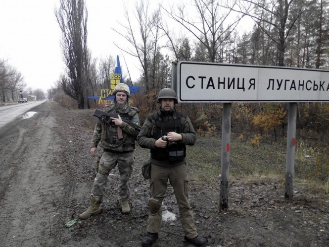 Министерство обороны пока не может начать процесс отвода войск в Станице Луганской из-за обстрелов боевиков. 